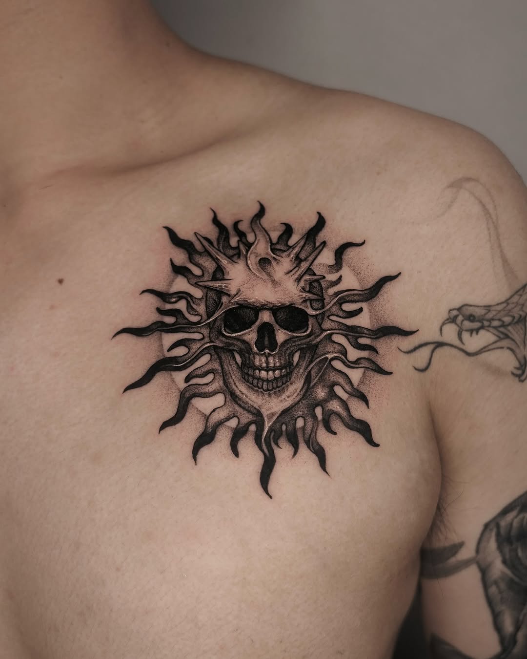 Skull with Crown of Thorns and Radiant Sunburst Tattoo